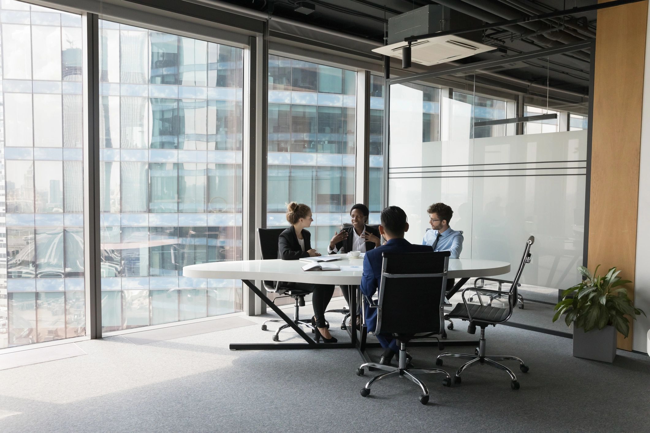 Consultants discussing business matters in a meeting room