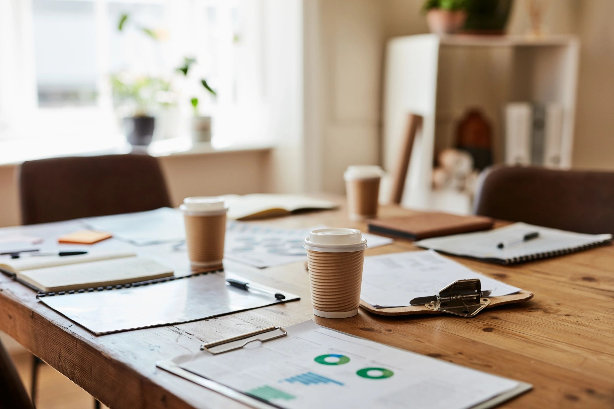 Prepared business documents and planning materials on a conference table