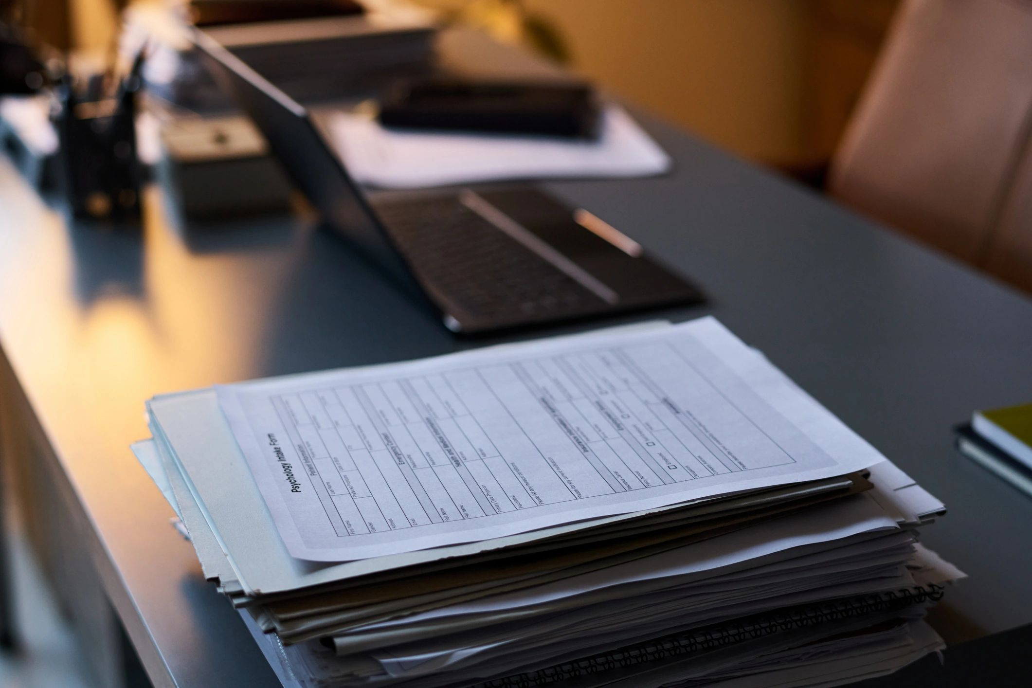 Organized compliance documents on a professional desk