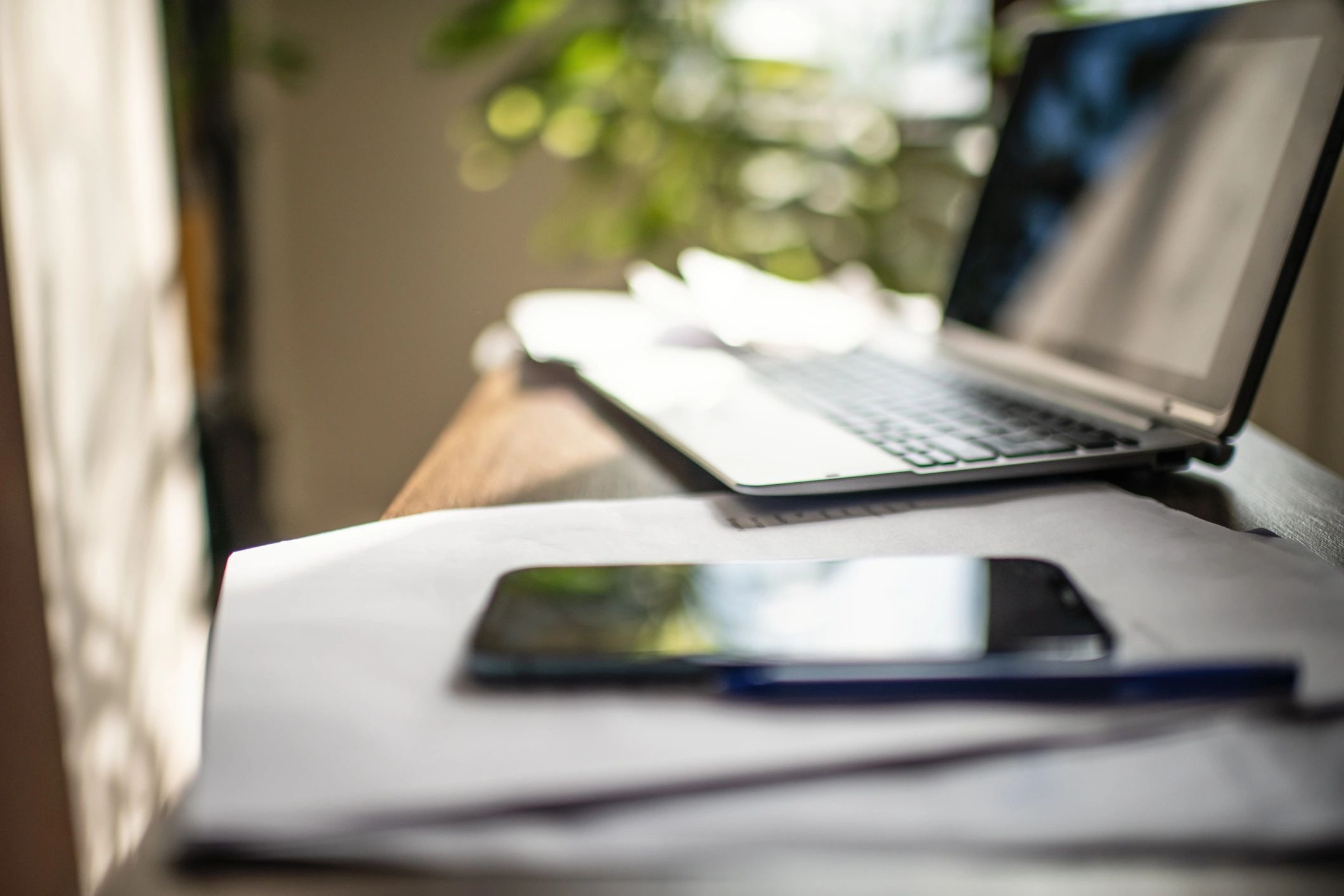 Laptop and documents on a table